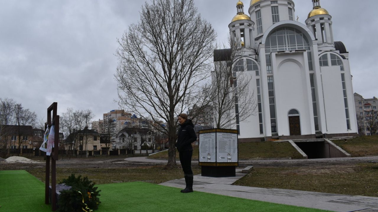 At the site of the mass grave at St Andrew’s church in Bucha where there is now a memorial to the victims of February and March 2022